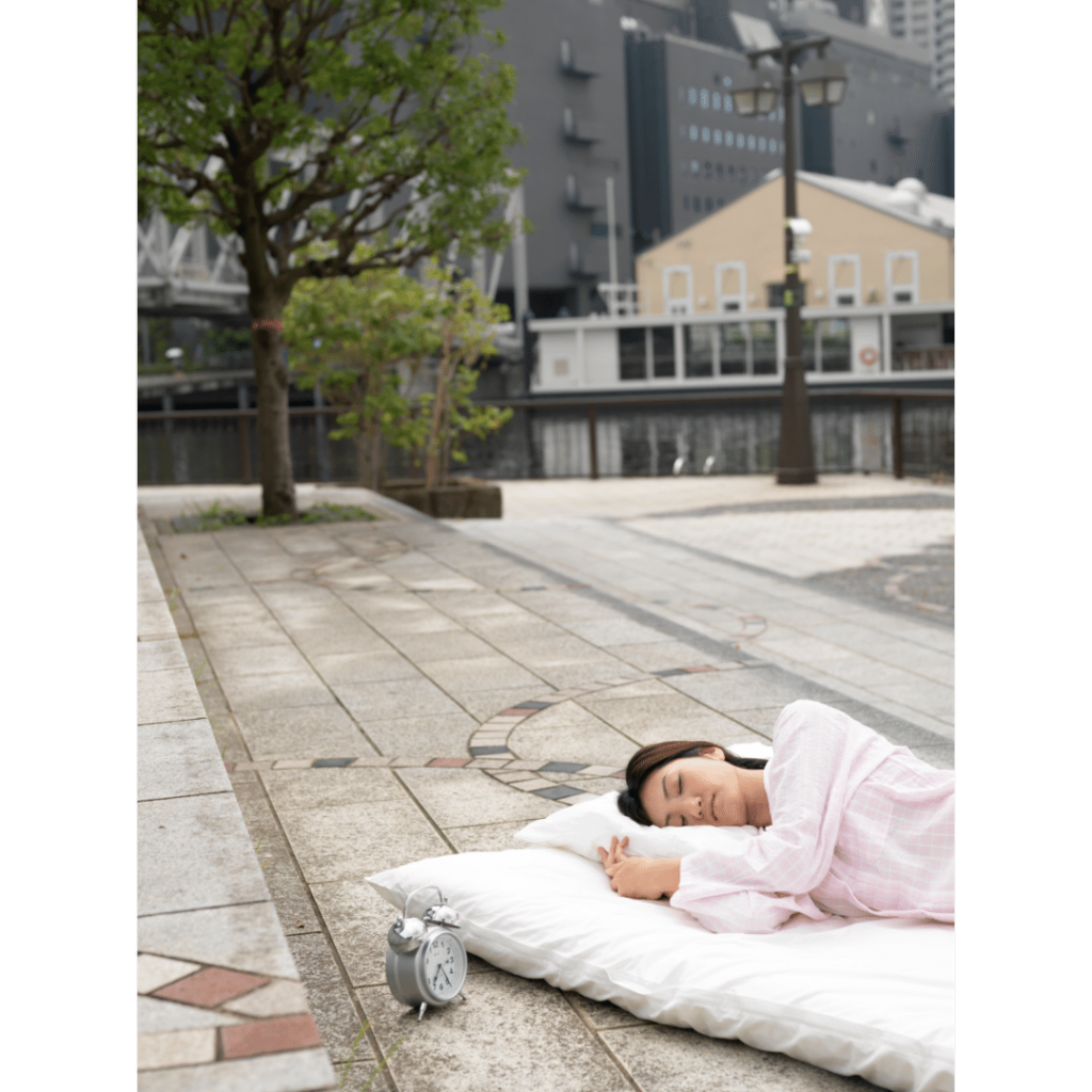 Japanese person sleeping on a futon